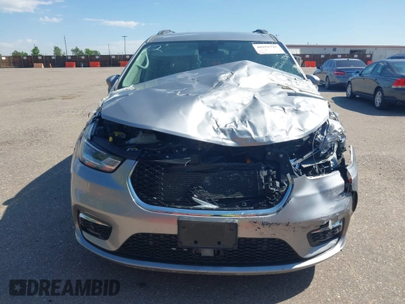 2021 Chrysler Pacifica Hybrid Touring L with VIN 2C4RC1L76MR594571, listed as a IAAI auction lot 40255745 with 58,163 mi miles and . Bid and sale history available at DreamBid. Image 12.