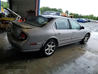 2001 Nissan Maxima SE z VIN JN1CA31A21T309782, wystawiony jako Copart lot #56696605 z przebiegiem 312 094 mil mil oraz Szkody całkowita. Historia ofert i sprzedaży dostępna na DreamBid. Obrazek 3.