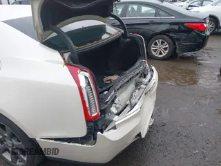 2014 Cadillac ATS Luxury AWD z VIN 1G6AH5RX1E0147092, wystawiony jako IAAI lot #40321476 z przebiegiem 115 224 mil mil oraz . Historia ofert i sprzedaży dostępna na DreamBid. Obrazek 6.