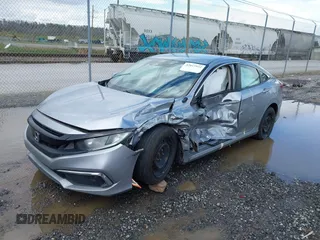 2019 Honda Civic LX with VIN 19XFC2F61KE009471, listed as a IAAI auction lot 42017532 with 81,134 mi miles and . Bid and sale history available at DreamBid. Image 2.