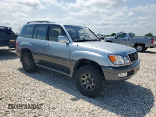 2001 Lexus LX 470 z VIN JTJHT00W313504330, wystawiony jako Copart lot #61126435 z przebiegiem 87 049 mil mil oraz Czysty tytuł • Clean title. Historia ofert i sprzedaży dostępna na DreamBid. Obrazek 4.