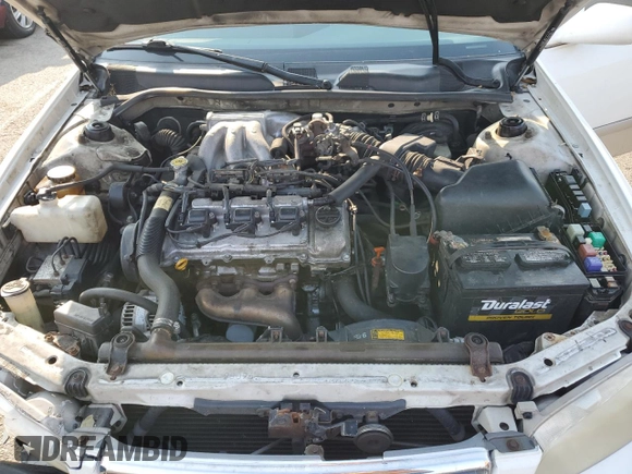 2001 Toyota Camry LE z VIN JT2BF22K010297055, wystawiony jako Copart lot #59510645 z przebiegiem 265 428 mil mil oraz Szkoda całkowita • Salvage title. Historia ofert i sprzedaży dostępna na DreamBid. Obrazek 11.