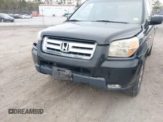 2007 Honda Pilot EX-L z VIN 2HKYF18517H513293, wystawiony jako IAAI lot #41957031 z przebiegiem 264 875 mil mil oraz . Historia ofert i sprzedaży dostępna na DreamBid. Obrazek 6.