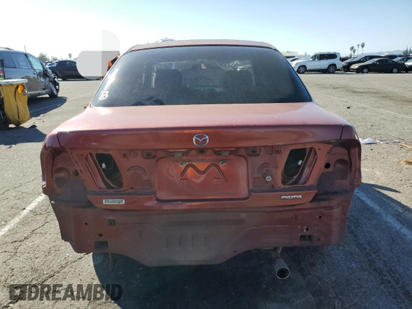 1998 Mazda Protege DX z VIN JM1BC1411W0198007, wystawiony jako Copart lot #46941185 z przebiegiem 101 696 mil mil oraz Szkoda całkowita • Salvage title. Historia ofert i sprzedaży dostępna na DreamBid. Obrazek 6.