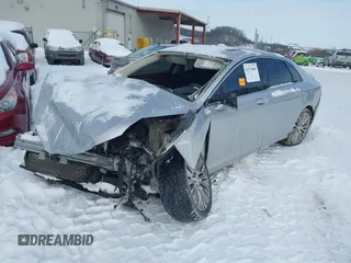 2014 Lincoln MKZ z VIN 3LN6L2J92ER832064, wystawiony jako IAAI lot #41374046 z przebiegiem 84 000 mil mil oraz . Historia ofert i sprzedaży dostępna na DreamBid. Obrazek 2.