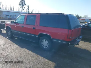 1996 GMC Suburban with VIN 1GKFK16R4TJ742646, listed as a IAAI auction lot 42004439 with 196,923 mi miles. Bid and sale history available at carsss.com. Image 3.