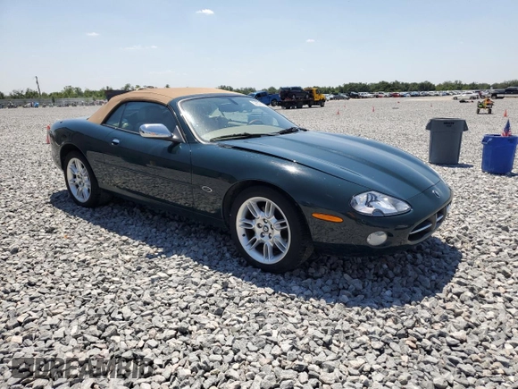 2002 Jaguar XK with VIN SAJDA42C62NA25816, listed as a Copart auction lot 52802525 with Not Provided miles and Salvage Title. Bid and sale history available at DreamBid. Image 4.