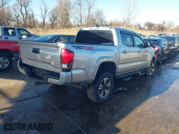 2018 Toyota Tacoma SR with VIN 5TFCZ5AN3JX151479, listed as a IAAI auction lot 41428376 with 104,717 mi miles. Bid and sale history available at carsss.com. Image 4.