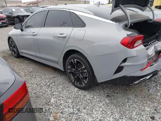 2023 Kia K5 GT-Line z VIN 5XXG64J25PG181772, wystawiony jako IAAI lot #42283124 z przebiegiem 40 857 mil mil oraz . Historia ofert i sprzedaży dostępna na DreamBid. Obrazek 3.