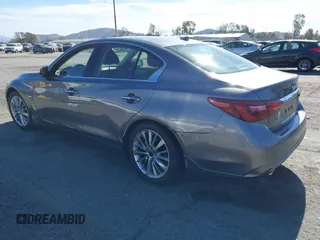2021 Infiniti Q50 Luxe z VIN JN1EV7BP3MM701871, wystawiony jako IAAI lot #41383333 z przebiegiem 28 634 mil mil oraz . Historia ofert i sprzedaży dostępna na DreamBid. Obrazek 3.