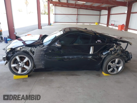 2008 Nissan 350Z z VIN JN1BZ34D98M705867, wystawiony jako IAAI lot #41871586 z przebiegiem 90 717 mil mil oraz . Historia ofert i sprzedaży dostępna na DreamBid. Obrazek 14.
