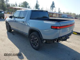 2022 Rivian R1T Adventure z VIN 7FCTGAAA5NN007018, wystawiony jako IAAI lot #42018939 z przebiegiem 41 991 mil mil oraz . Historia ofert i sprzedaży dostępna na DreamBid. Obrazek 3.