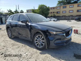 2021 Mazda CX-5 Grand Touring with VIN JM3KFBDM4M1462570, listed as a Copart auction lot 54827675 with 45,389 mi miles and Salvage Title. Bid and sale history available at DreamBid. Image 4.