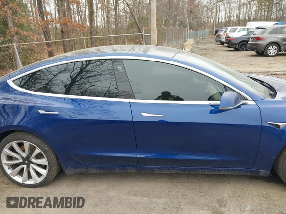 2019 Tesla Model 3 Long Range with VIN 5YJ3E1EB9KF454007, listed as a IAAI auction lot 41769346 with 141,609 mi miles. Bid and sale history available at carsss.com. Image 13.