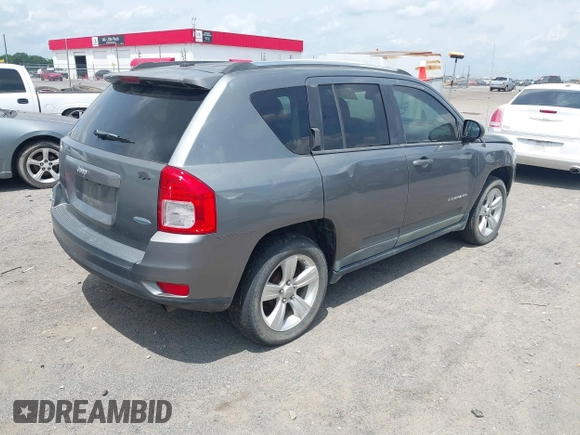 2011 Jeep Compass Latitude with VIN 1J4NT1FB4BD246549, listed as a IAAI auction lot 42156761 with 232,739 mi miles. Bid and sale history available at carsss.com. Image 4.