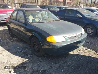 2000 Mazda Protege DX with VIN JM1BJ2229Y0235881, listed as a IAAI auction lot 41484779 with 283,054 mi miles and . Bid and sale history available at DreamBid. Image 1.