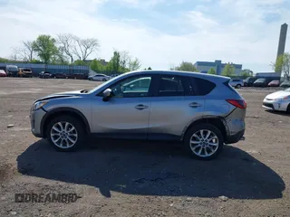 2014 Mazda CX-5 Grand Touring with VIN JM3KE4DY7E0311893, listed as a IAAI auction lot 42090872 with 102,154 mi miles and . Bid and sale history available at DreamBid. Image 14.