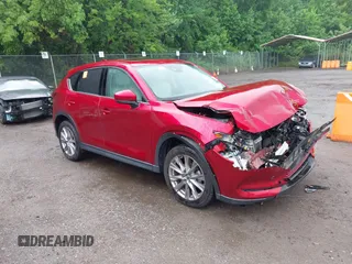 2019 Mazda CX-5 Grand Touring with VIN JM3KFBDM8K0693622, listed as a IAAI auction lot 42503818 with 60,812 mi miles and . Bid and sale history available at DreamBid. Image 1.