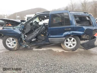 2002 Jeep Grand Cherokee Laredo with VIN 1J4GW48S82C321712, listed as a IAAI auction lot 41855809 with 1 mi miles. Bid and sale history available at carsss.com. Image 14.