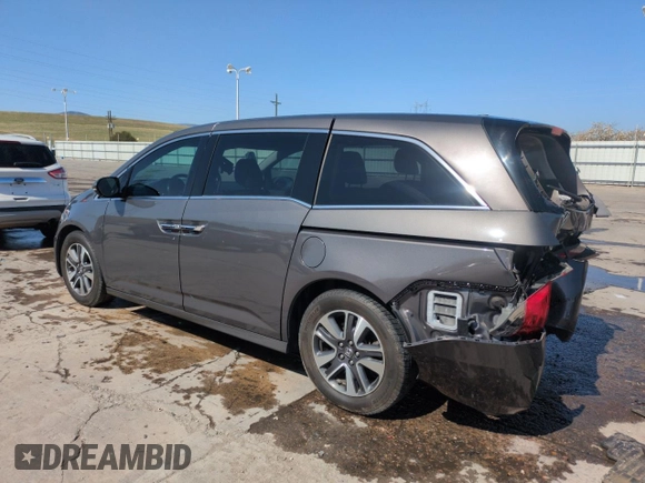 2014 Honda Odyssey Touring with VIN 5FNRL5H95EB052523, listed as a Copart auction lot 52214055 with 131,350 mi miles and Salvage Title. Bid and sale history available at DreamBid. Image 2.
