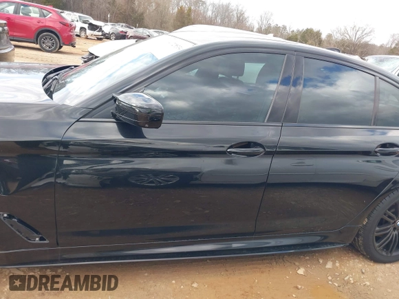 2019 BMW 5 Series M550i xDrive with VIN WBAJB9C56KB464957, listed as a IAAI auction lot 41729334 with Not provided miles and . Bid and sale history available at DreamBid. Image 14.