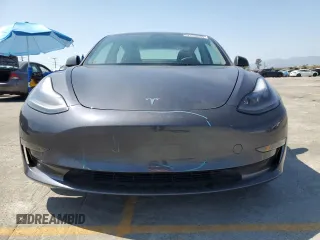 2023 Tesla Model 3 with VIN 5YJ3E1EA3PF695267, listed as a Copart auction lot 52559645 with 9,025 mi miles and Salvage title. Bid and sale history available at DreamBid. Image 5.