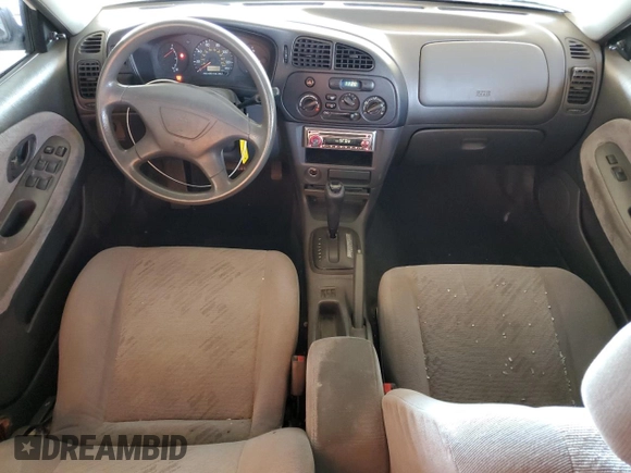 2001 Mitsubishi Mirage ES z VIN JA3AY26CX1U013535, wystawiony jako Copart lot #57664885 z przebiegiem 159 095 mil mil oraz Szkoda całkowita • Salvage title. Historia ofert i sprzedaży dostępna na DreamBid. Obrazek 8.