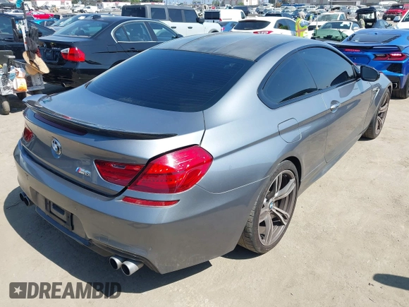 2013 BMW M6 with VIN WBSLX9C51DC968593, listed as a IAAI auction lot 42465979 with 88,010 mi miles and . Bid and sale history available at DreamBid. Image 4.
