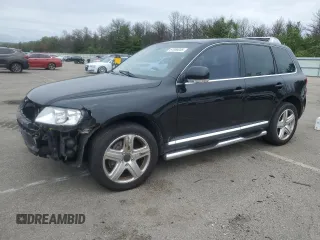 2004 Volkswagen Touareg with VIN WVGCC67LX4D001013, listed as a Copart auction lot 61066055 with 82,801 mi miles and Salvage title. Bid and sale history available at DreamBid. Image 1.