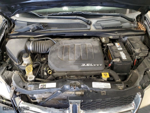 2013 Dodge Grand Caravan SXT with VIN 2C4RDGCG8DR592059, listed as a Copart auction lot 83429054 with 184,866 mi miles and Salvage Title. Bid and sale history available at carsss.com. Image 12.