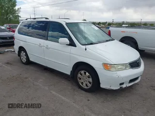 2001 Honda Odyssey EX z VIN 2HKRL18661H566973, wystawiony jako IAAI lot #42117015 z przebiegiem 206 999 mil mil oraz . Historia ofert i sprzedaży dostępna na DreamBid. Obrazek 1.