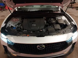 2023 Mazda CX-50 S Premium Plus with VIN 7MMVABEMXPN139186, listed as a IAAI auction lot 41289690 with 26,556 mi miles and . Bid and sale history available at DreamBid. Image 10.