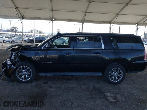 2016 GMC Yukon XL SLE with VIN 1GKS1FKC2GR147222, listed as a IAAI auction lot 41390201 with 86,385 mi miles. Bid and sale history available at carsss.com. Image 14.