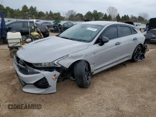 2022 Kia K5 GT-Line z VIN 5XXG64J22NG144899, wystawiony jako Copart lot #53707205 z przebiegiem 19 633 mil mil oraz Szkoda całkowita • Salvage title. Historia ofert i sprzedaży dostępna na DreamBid. Obrazek 1.