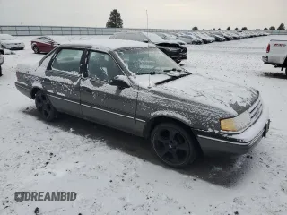 1990 Ford Tempo z VIN 1FAPP36X4LK167346, wystawiony jako Copart lot #84089494 z przebiegiem 66 291 mil mil oraz Szkody całkowita. Historia ofert i sprzedaży dostępna na DreamBid. Obrazek 4.