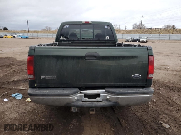 2000 Ford F-250 XL with VIN 1FTNW21F5YEB21513, listed as a Copart auction lot 82013464 with 383,819 mi miles and Salvage title. Bid and sale history available at DreamBid. Image 6.