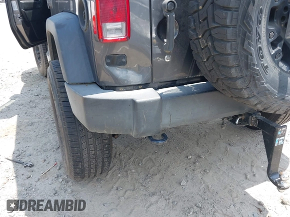 2017 Jeep Wrangler Unlimited Sport with VIN 1C4BJWDG6HL517779, listed as a IAAI auction lot 42134534 with 128,701 mi miles and . Bid and sale history available at DreamBid. Image 6.