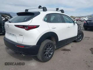 2021 Mazda CX-30 2.5 S with VIN 3MVDMAAL8MM226728, listed as a IAAI auction lot 41492548 with 56,826 mi miles. Bid and sale history available at carsss.com. Image 4.