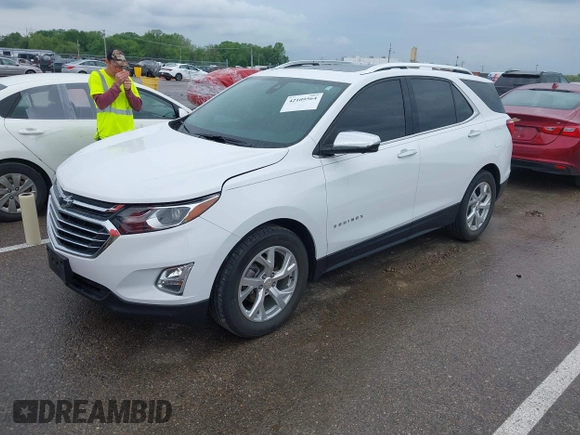 2021 Chevrolet Equinox Premier with VIN 3GNAXNEV5MS160043, listed as a IAAI auction lot 42109564 with 36,808 mi miles and . Bid and sale history available at DreamBid. Image 2.