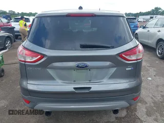 2013 Ford Escape SE with VIN 1FMCU9G95DUC01185, listed as a IAAI auction lot 42602840 with 140,697 mi miles and . Bid and sale history available at DreamBid. Image 16.