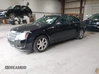 2008 Cadillac CTS AWD z VIN 1G6DH577780191604, wystawiony jako IAAI lot #42506015 z przebiegiem 137 958 mil mil oraz . Historia ofert i sprzedaży dostępna na DreamBid. Obrazek 2.