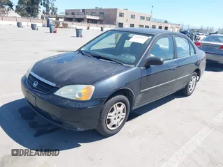 2001 Honda Civic DX with VIN 2HGES15241H573417, listed as a IAAI auction lot 41890215 with 335,619 mi miles. Bid and sale history available at carsss.com. Image 2.