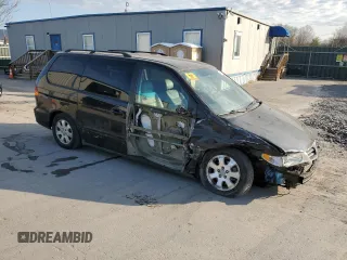 2003 Honda Odyssey EX-L with VIN 5FNRL189X3B114181, listed as a Copart auction lot 54316105 with 103,214 mi miles and Salvage Title. Bid and sale history available at DreamBid. Image 4.