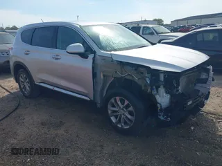 2019 Hyundai Santa Fe SE z VIN 5NMS23AD9KH028260, wystawiony jako IAAI lot #41899430 z przebiegiem 97 932 mil mil oraz . Historia ofert i sprzedaży dostępna na DreamBid. Obrazek 1.