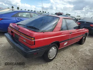 1987 Nissan Sentra z VIN JN1PB2411HU026525, wystawiony jako Copart lot #78997744 z przebiegiem 65 716 mil mil oraz Nie do naprawy. Historia ofert i sprzedaży dostępna na DreamBid. Obrazek 3.