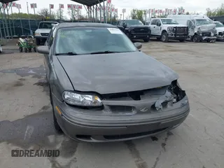 1999 Oldsmobile Cutlass GLS z VIN 1G3NG52J1X6338096, wystawiony jako IAAI lot #42001327 z przebiegiem 77 452 mil mil oraz . Historia ofert i sprzedaży dostępna na DreamBid. Obrazek 13.