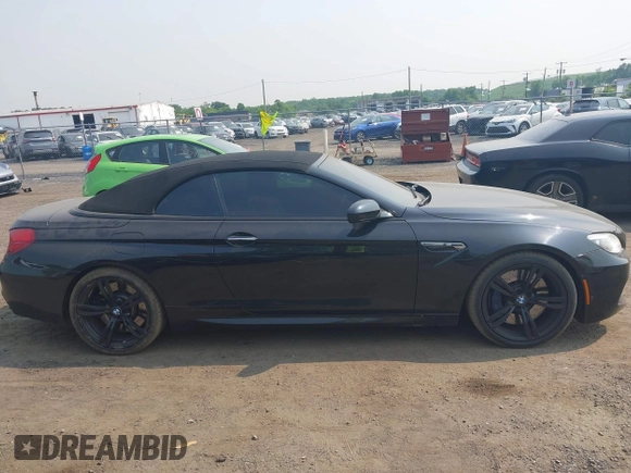 2014 BMW M6 z VIN WBSLZ9C5XEDZ78402, wystawiony jako IAAI lot #42399055 z przebiegiem 127 803 mil mil oraz . Historia ofert i sprzedaży dostępna na DreamBid. Obrazek 13.