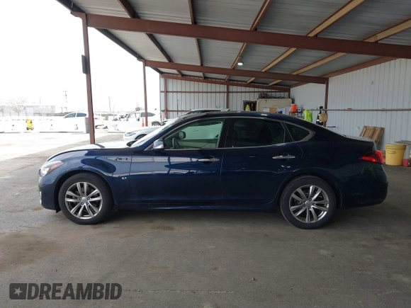 2015 Infiniti Q70 z VIN JN1BY1AP9FM542429, wystawiony jako IAAI lot #41903214 z przebiegiem 139 255 mil mil oraz . Historia ofert i sprzedaży dostępna na DreamBid. Obrazek 14.