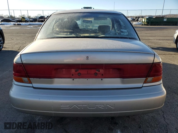 1999 Saturn SL z VIN 1G8ZK5272XZ163225, wystawiony jako Copart lot #41788725 z przebiegiem 144 999 mil mil oraz Szkoda całkowita • Salvage title. Historia ofert i sprzedaży dostępna na DreamBid. Obrazek 6.
