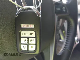 2014 Honda Odyssey Touring with VIN 5FNRL5H99EB075979, listed as a IAAI auction lot 42520154 with 99,314 mi miles and . Bid and sale history available at DreamBid. Image 11.